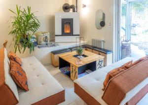 a living room with a couch and a table at La Maison Mori in Vienne