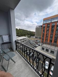 a balcony with a view of a parking lot at Alvina complex in Tsaghkadzor