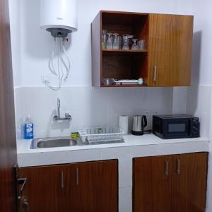 Kuchyň nebo kuchyňský kout v ubytování Studio YaciAdjo