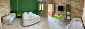 a large bathroom with a tub and a sink at Hotel das Falésias Praia das Fontes in Beberibe