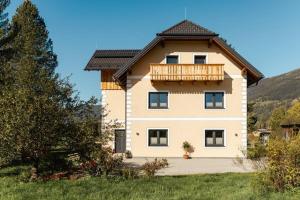 a large house with a balcony on top of it at Landhaus im Feld in Sankt Michael im Lungau