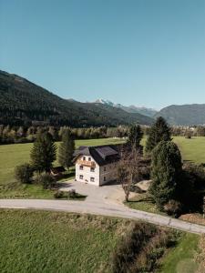 an aerial view of a house in a field at Landhaus im Feld in Sankt Michael im Lungau