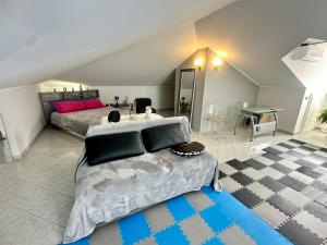 a bedroom with a large bed and a table at Oasi di Monchiero in Monchiero
