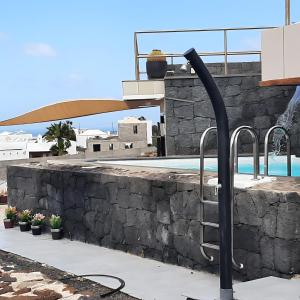 a swimming pool with a pool at Villa Atlantis in Las Breñas