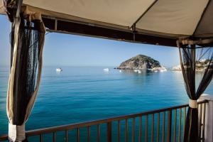 a view of the ocean from a balcony at Hotel Regina del Mare in Ischia