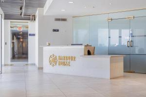 a lobby with a reception desk in a building at Hh-3Bs612 - Amazing Beach Condo Oceanfront In Aruba! in Oranjestad +32 photos