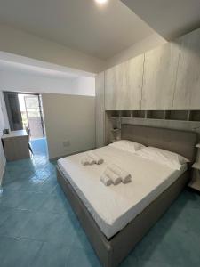Postel nebo postele na pokoji v ubytování IL DIAMANTE SUL MARE