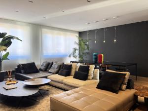 a living room with a couch and a table at Langhe Panorama in Alba