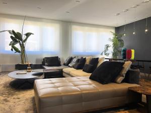 a living room with a couch and a table at Langhe Panorama in Alba