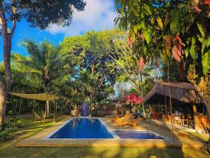 a swimming pool in the middle of a resort at Villa Cacau - Floresta in Trancoso +59 photos
