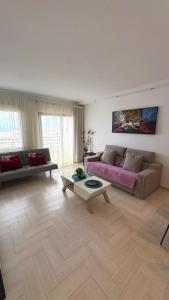 a living room with a couch and a table at Bonito in Adeje +21 photos