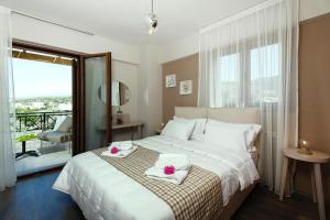 a bedroom with a bed with two towels on it at Cottage in Adele in Ádhele +13 photos