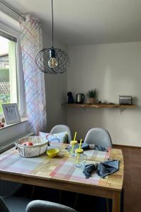 a dining room table with a table cloth on it at Ferienwohnung Dorfliebe 