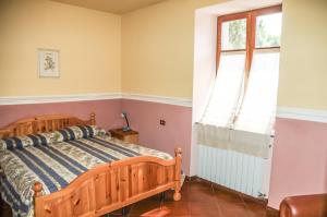 Postel nebo postele na pokoji v ubytování Agriturismo La Praduscella
