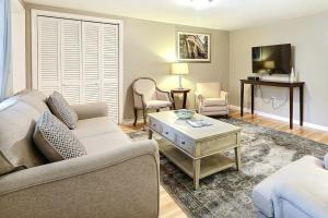 a living room with a couch and a table at Oglethorpe Estate in Savannah
