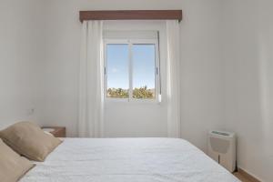 Postel nebo postele na pokoji v ubytování Casa P Cortijo