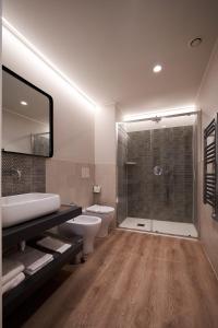 a bathroom with a shower and a toilet and a sink at CA' San Cristoforo in Milan +43 photos