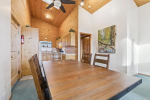 a large wooden table in a kitchen with a ceiling at 587 Danube Drive condo in Lake Valley