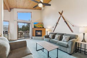 a living room with a couch and a fireplace at 587 Danube Drive condo in Lake Valley