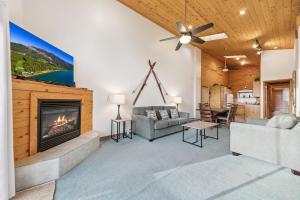 a living room with a fireplace and a couch at 587 Danube Drive condo in Lake Valley