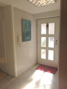 an empty room with a door and a window at Ferienwohnung Graf in Tübingen