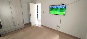 a television hanging on a wall in a room at Casa Xperience in Malargüe