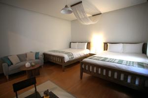 En eller flere senge i et værelse på Euphoria