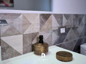 a bathroom counter with a soap dispenser on a sink at Domus Derthona Alloggio Ester Mietta in Tortona +26 photos