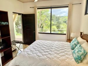 Postel nebo postele na pokoji v ubytování Olas de Oro