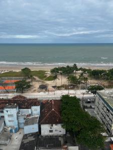 a view of the beach from a building at Quarto a 10m da praia ao lado de Pubs e Restaurantes in Recife