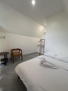 Postel nebo postele na pokoji v ubytování Passeo De Lucas Hometel - Siquijor