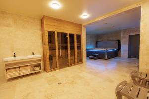 a large bathroom with a tub and a sink at Quantara Resort Domaša in Holčíkovce