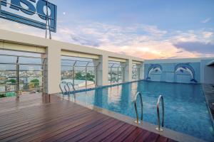 a swimming pool in a building with a view at Park Inn by Radisson Lucknow Vikas Nagar in Lucknow
