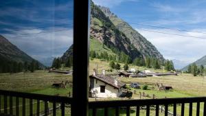 a view of a mountain from a window at Case Gran Paradiso Rhemes Notre Dame Piazza in Rhêmes-Notre-Dame