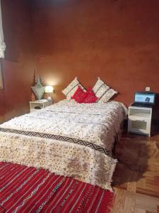 Ένα ή περισσότερα κρεβάτια σε δωμάτιο στο Ecolodge Tamount Farah