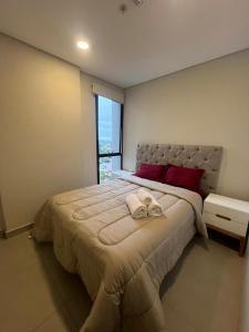 Postel nebo postele na pokoji v ubytování Stylish 2 Bedroom Apt In Molas Lopez