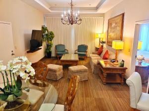 a living room with a couch and a table at Holiday Inn Reynosa Zona Dorada by IHG in Reynosa