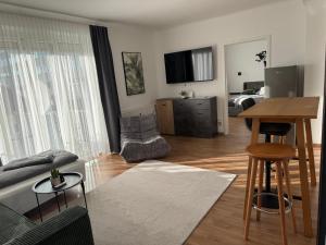 a living room with a couch and a table at 1A Wohntraum in Graz