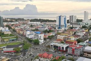 an aerial view of a city with buildings and cars at Lemonade Hotel in Gua Sai