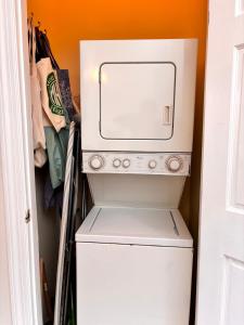 a white washer and dryer in a room at Luxurious bedroom in New York