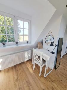 Fotografie z fotogalerie ubytování Lichtdurchflutete Dachgeschosswohnung mit Charme v destinaci Goldenstedt