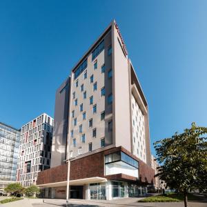 an office building in a city with tall buildings at Hampton By Hilton Bogota Airport in Bogotá