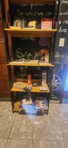 a book shelf filled with lots of books at Jeremias Hostel Bar in Vila Velha