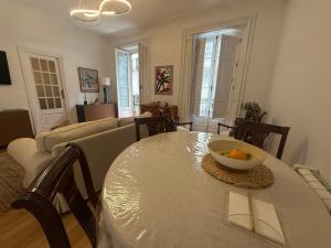 a living room with a table with a bowl of fruit on it at Estrecha de San Andres in A Coruña