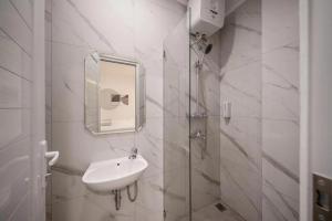 Koupelna v ubytování Wyneth Hotel Airport + 12 fotografií