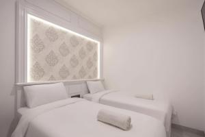 Postel nebo postele na pokoji v ubytování Wyneth Hotel Airport