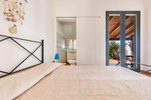 a bedroom with a large bed in a room at Villa Simona - Torre Lapillo in Isola della Malva