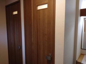 a pair of wooden doors in a room at 蔵王温泉 林檎屋 in Yamagata +42 photos