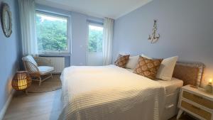 Ένα ή περισσότερα κρεβάτια σε δωμάτιο στο Haus Frauenpreiss Whg 57 KüstenNest +38 φωτογραφίες