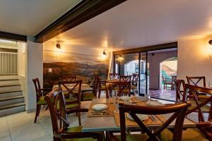 a dining room with a table and chairs at Majestic Colonial Villa Private Pool Jacuzzi and Gardens in Ocotepec